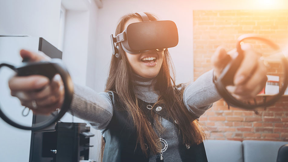 Pretty young girl wearing virtual reality goggles